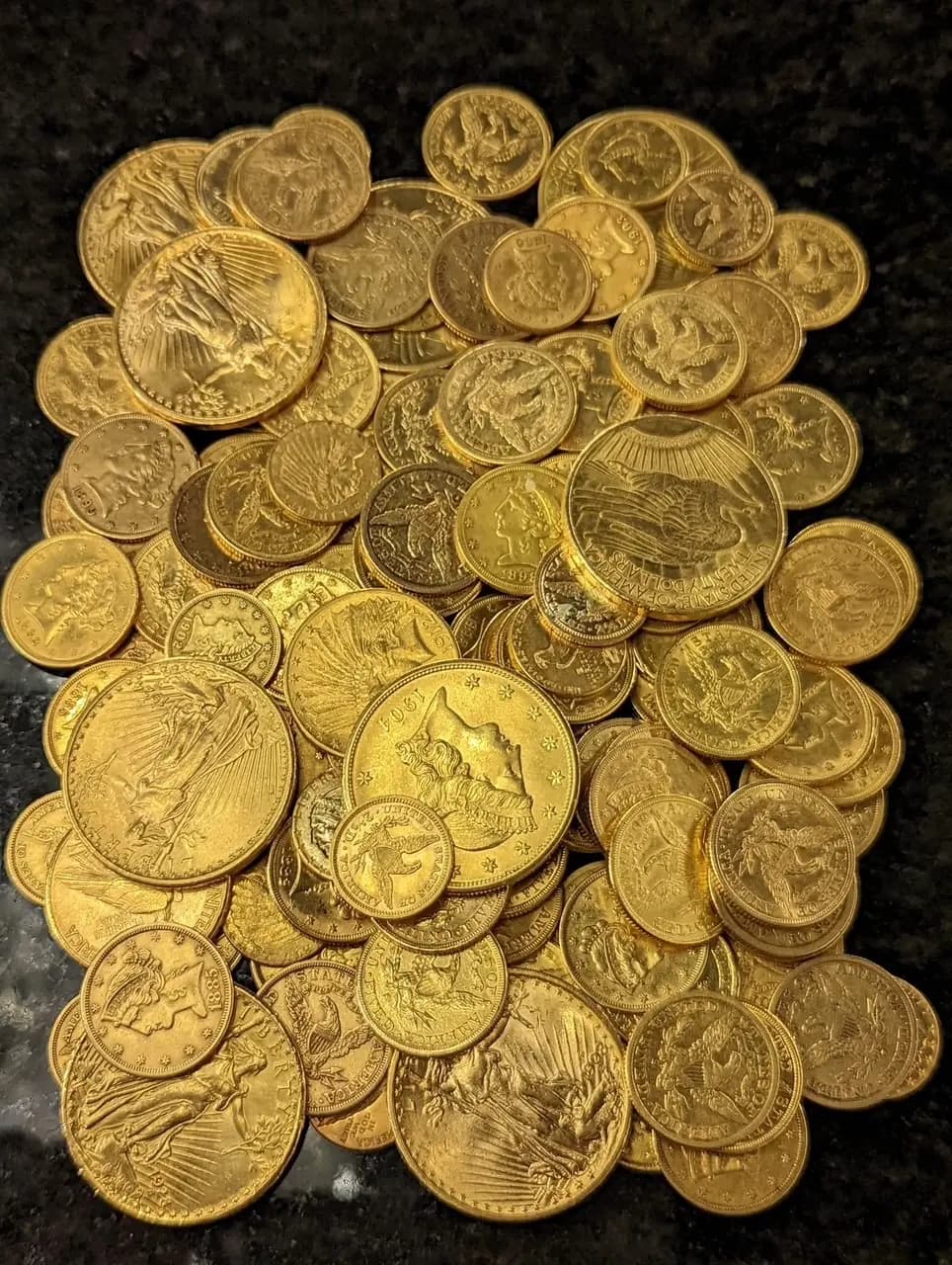 A pile of pre-1933 US gold coins, Double Eagles and Liberty Heads, bought at our counter