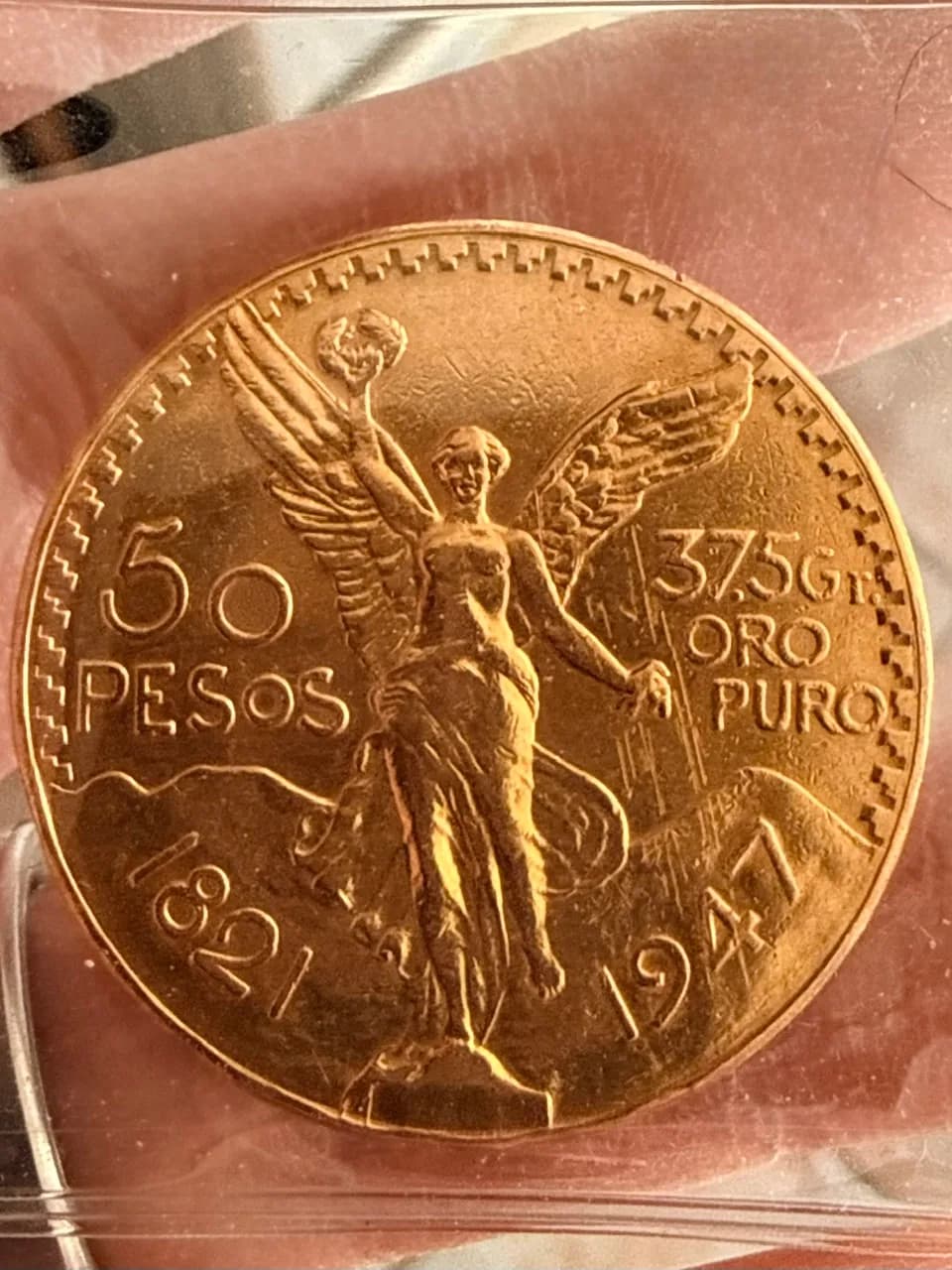 Close-up of a 1947 Mexican 50 peso gold coin, 37.5 grams of pure gold